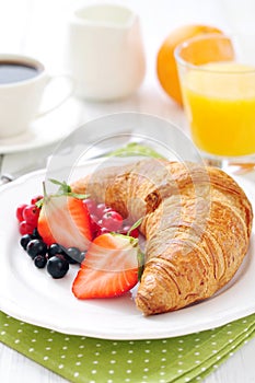Fresh croissant with berries