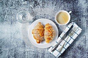 Fresh croissants with berries and cup of coffee