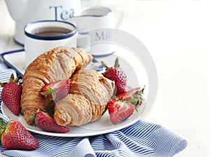 Fresh croissants and cup of tea