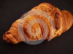 Fresh croissants on a dark background