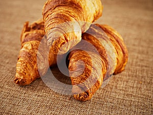 Fresh croissants on a dark background