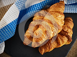 Fresh croissants on a dark background