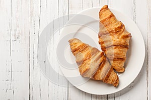 Fresh croissants on a plate