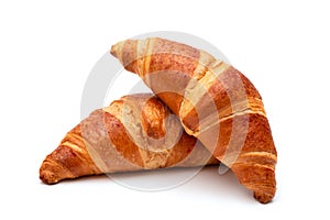 Fresh croissants on a white background closeup. French pastries
