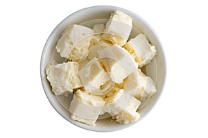 Fresh crumbly traditional feta cheese in a bowl