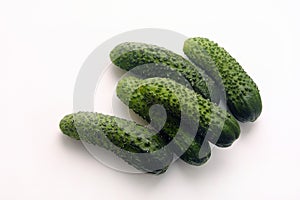 Fresh crunchy cucumbers on white