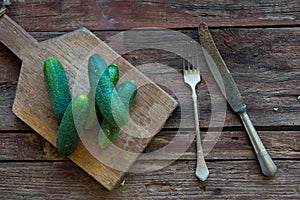 Fresh cucumber on the wood plate