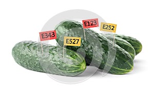 Fresh cucumbers with E numbers on background. Harmful food additives