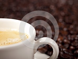 Fresh cup of dark roasted coffee