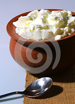 Fresh curd with clay pot on jute cloth