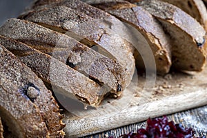 fresh cut bread made of flour and dried cranberries