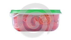 Fresh cut cherry tomatoes in plastic container isolated on white