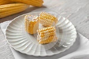 Fresh cut corn cob on plate