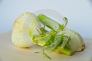 Fresh cut fennel on white cutting board