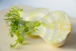 Fresh cut fennel on white cutting board