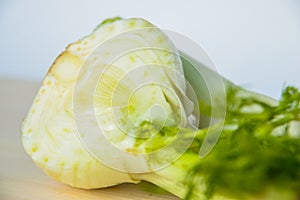 Fresh cut fennel on white cutting board