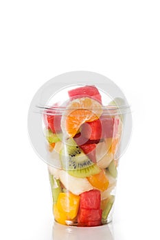 Fresh cut fruit in a plastic cup