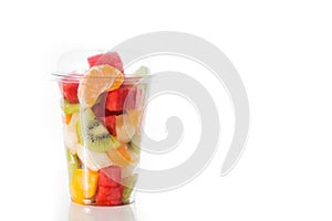 Fresh cut fruit in a plastic cup