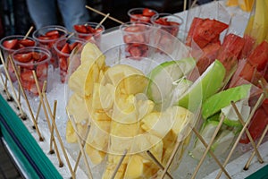 Fresh cut fruit, strawberry, watermelon and pineapple in ready to eat package at street stall vendor