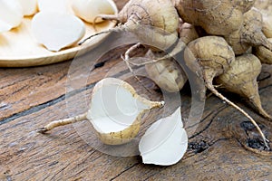 Fresh cut jicama on wooden board