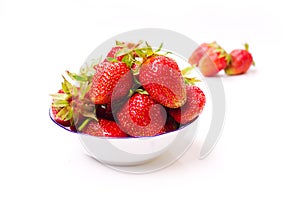 The fresh cut strawberries on white