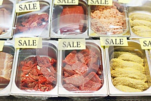 Fresh cuts of red beef meat and cutlets in store