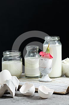 Fresh dairy and fermented milk products. Eggs On a black background