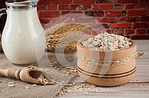 Fresh dairy products and wheat on rustic wooden background. Organic farming dairy concept