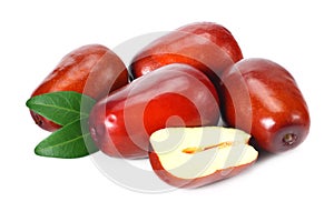 fresh date fruit with sleces and leaves isolated on white background