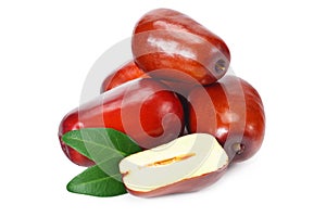 fresh date fruit with sleces and leaves isolated on white background