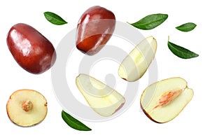 Fresh date fruit with sleces and leaves isolated on white background. top view