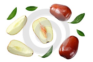 fresh date fruit with sleces and leaves isolated on white background. top view