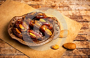 Fresh dates with almonds on a table