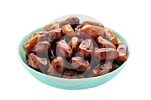 Fresh dates in mint bowl isolated on white background. Close up