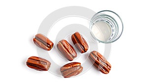 Fresh Dates Stuffed with Almonds and Glass of Milk on White Background