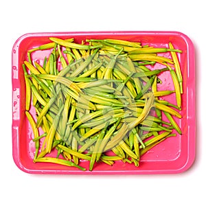 Fresh daylily in a wooden plate, Daylily not only can heal the sick, or a delicious dish.