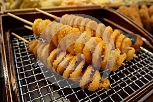 Fresh deep fried potatoes as japanese street food in Osaka