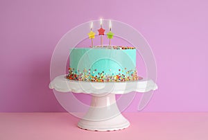 Fresh delicious birthday cake with candles on stand