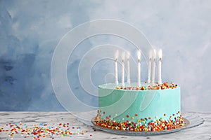 Fresh delicious birthday cake with candles