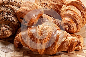 Fresh delicious croissants in bakery
