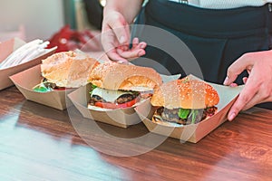 Fresh delicious grilled burgers on open food festival event. Street food festival