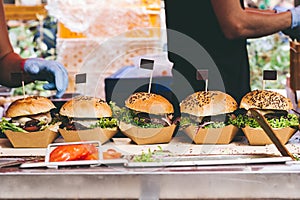 Fresh delicious grilled burgers on the table. Burger festival