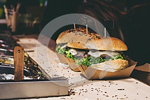 Fresh delicious grilled burgers on the table. Burger festival