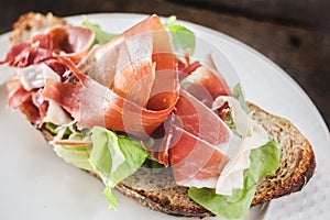 Fresh and delicious ham coldcut with bread on white plate