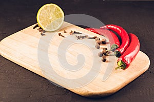 Fresh delicious ingredients and empty cutting board/Fresh delicious ingredients and empty cutting board on a dark background