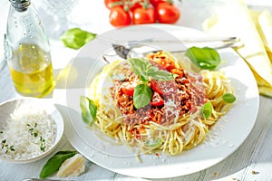 Fresh and delicious spagetti bolognese on wooden table.
