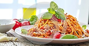 Fresh and delicious spagetti bolognese on wooden table. photo