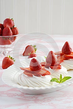 Fresh dessert of strawberry meringue nests