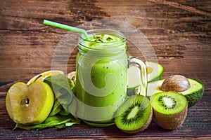 Fresh detox green smoothie with avocado, apple,kiwi, salad with