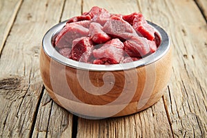 Fresh diced raw meat in a doggy bowl